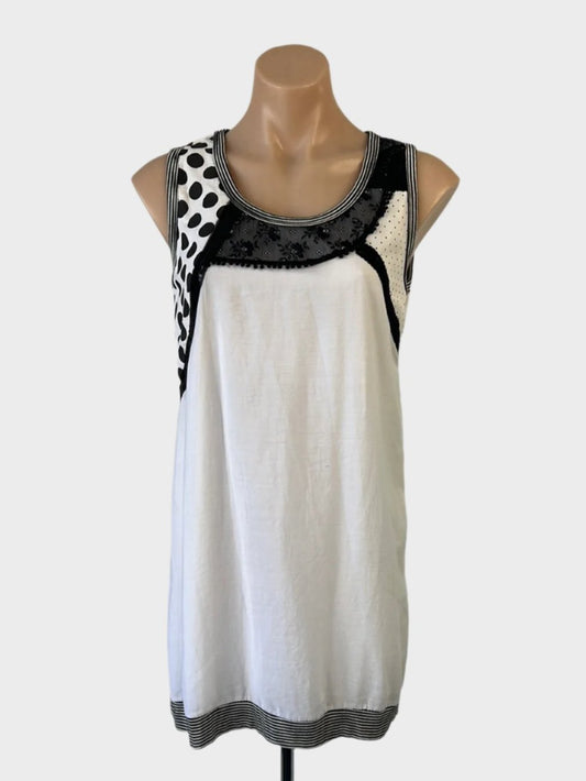 HEMPEL sleeveless shift dress in black & white cotton with polka dot, lace, and sequin panels, U-shaped neck, and rib trim for smart casual wear.