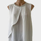 Liz Jordan sleeveless dress in white sheer crepe, featuring pleated front with draped overlay, round neck with diamante and pearl trim, yoke back, and shirt tail hem for special events or formal occasions.