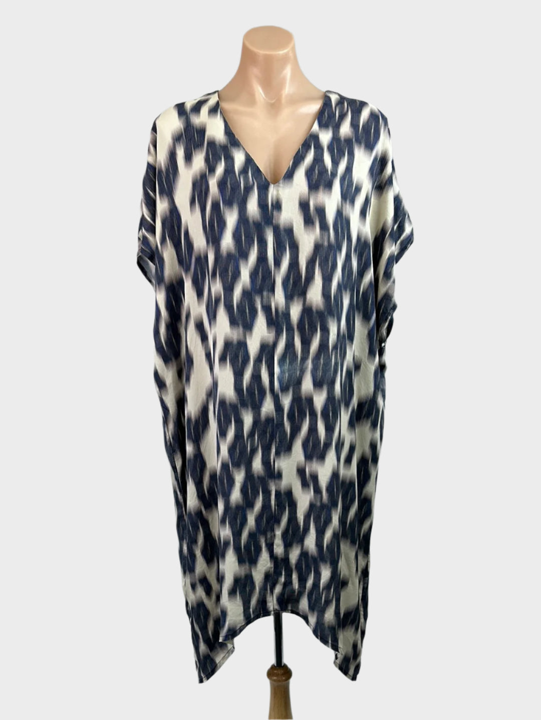 Mother of All Things grey sleeveless cocoon dress in pure silk with ikat style print, v-neck, drop shoulder, and curved hem for smart casual wear.