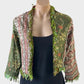 Designer Silver Cocoonz boho style open front cardigan jacket in green pure silk, featuring fringe trim, floral embroidery, and three quarter sleeves for events or smart casual occasions.