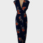 Sleeveless sheath dress in crepe with navy and orange floral print, featuring a surplice neck, pleated pencil skirt with slash pockets, and front split for evening wear.