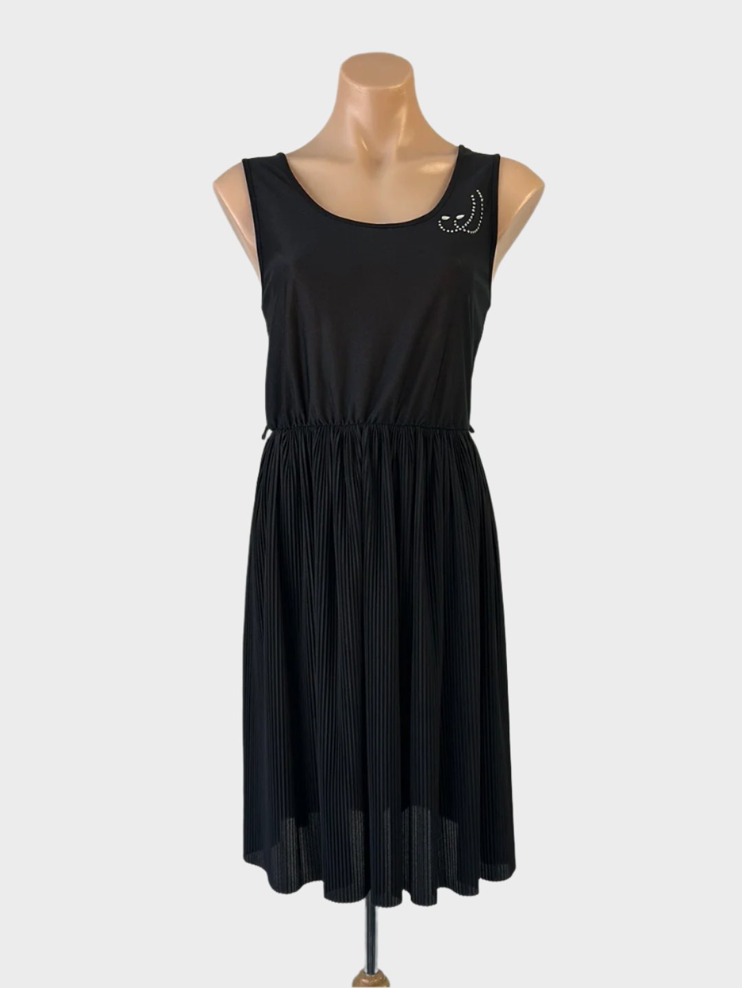 Designer St Michael vintage 80s sleeveless A-line dress in black jersey with satin finish, scoop back, and pleated skirt for evening wear.