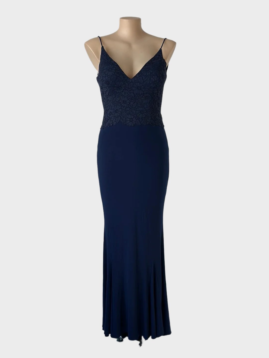 Tania Olsen sleeveless gown in midnight blue jersey with lace bodice, v-neck, and godet skirt with sweep train for formal occasions.