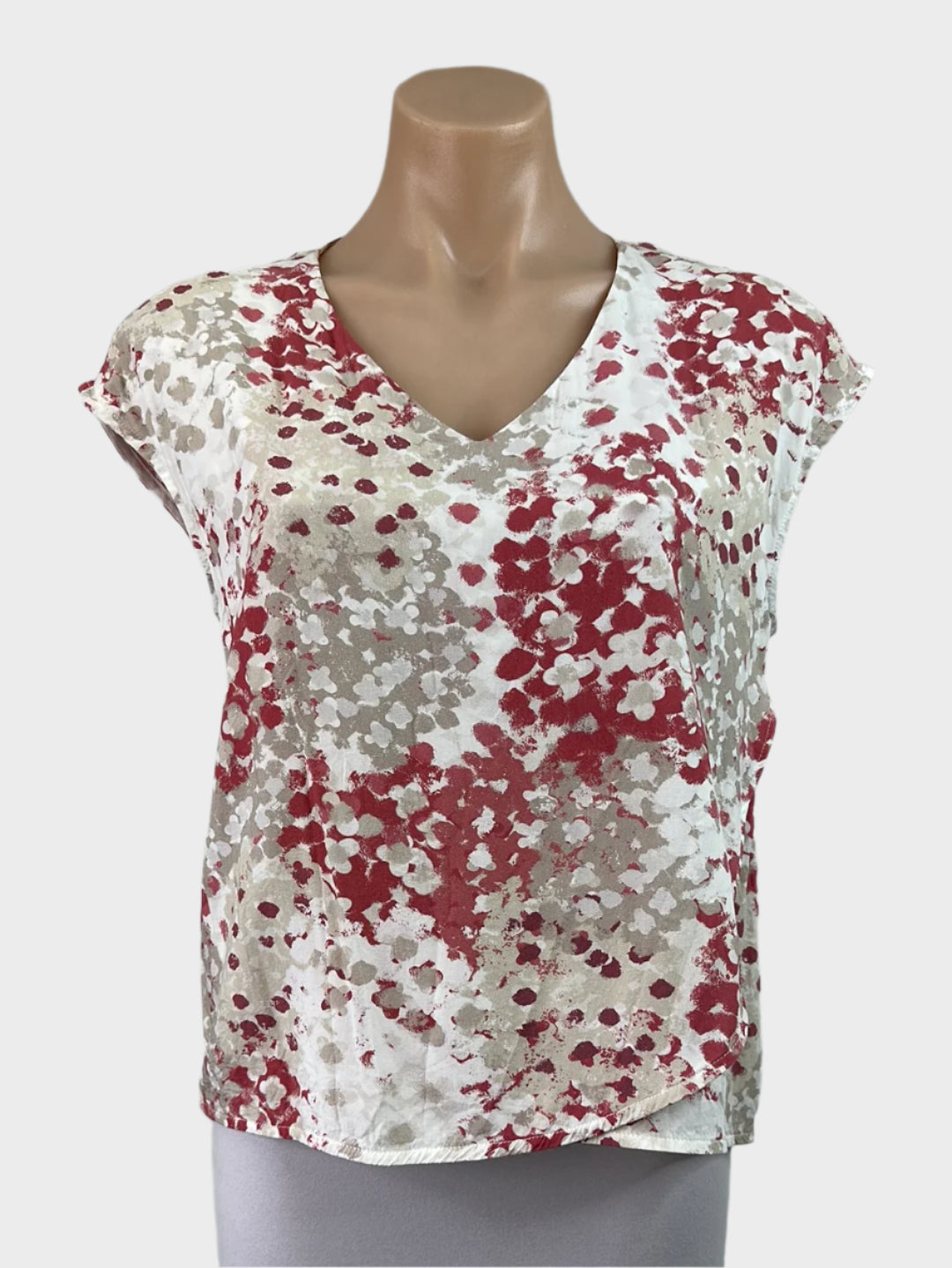 Designer The Ark cream and pink sleeveless top with abstract floral print, lap-over front panel, and v-neck for smart casual or office wear.