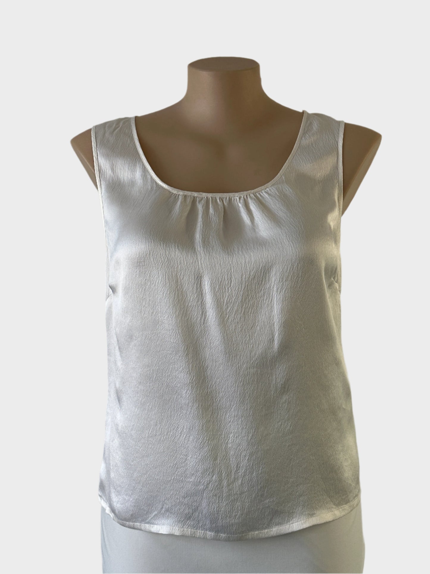 Trent Nathan white silk top with a puckered satin finish and sunburst neck for evening or special events.