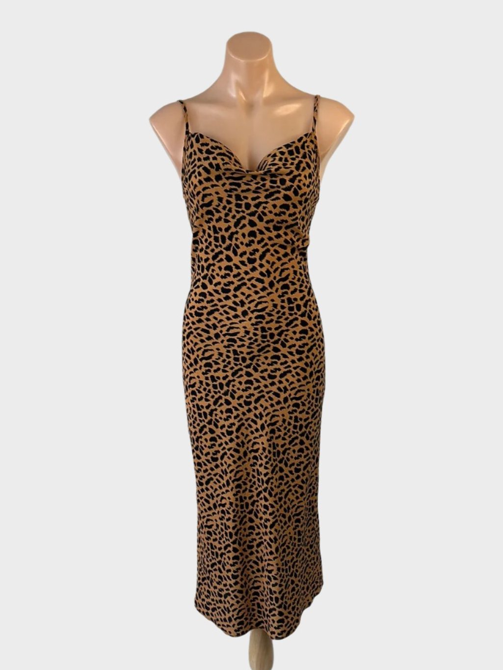 Tussah bias-cut slip dress in leopard print textured weave with cowl neck and spaghetti straps for evening wear.