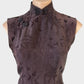 Vintage 60s cheongsam in brown silk jacquard with chrysanthemum pattern, asymmetric closure, and pencil skirt for evening.