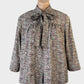 Vintage 60s open front jacket in mauve Liberty floral print, featuring a band collar with pussy bow, three-quarter sleeves, and gathered yoke for smart casual.