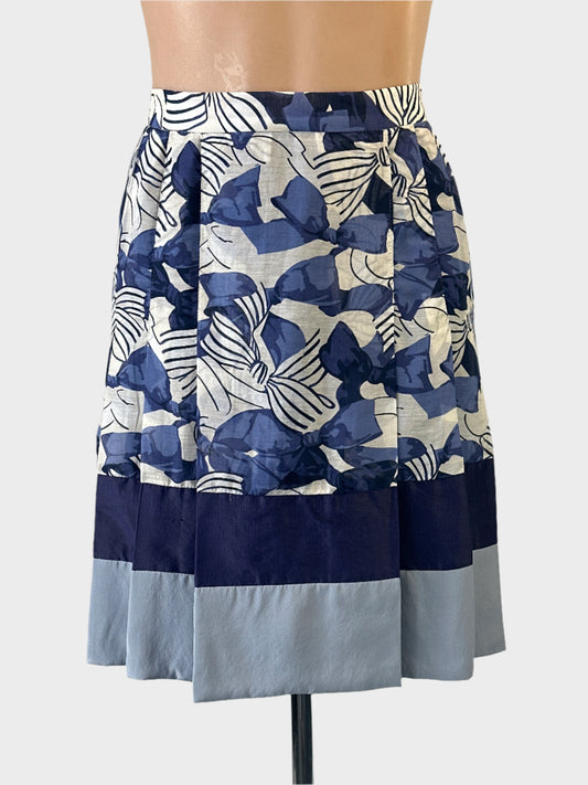 Designer Alannah Hill pleated skirt in blue and white with ribbons and bows print for special events or smart casual wear.