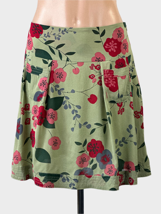 Designer Alannah Hill sage green pleated silk skirt with Japanese floral print, hip band and top stitched hem for smart casual or business wear.