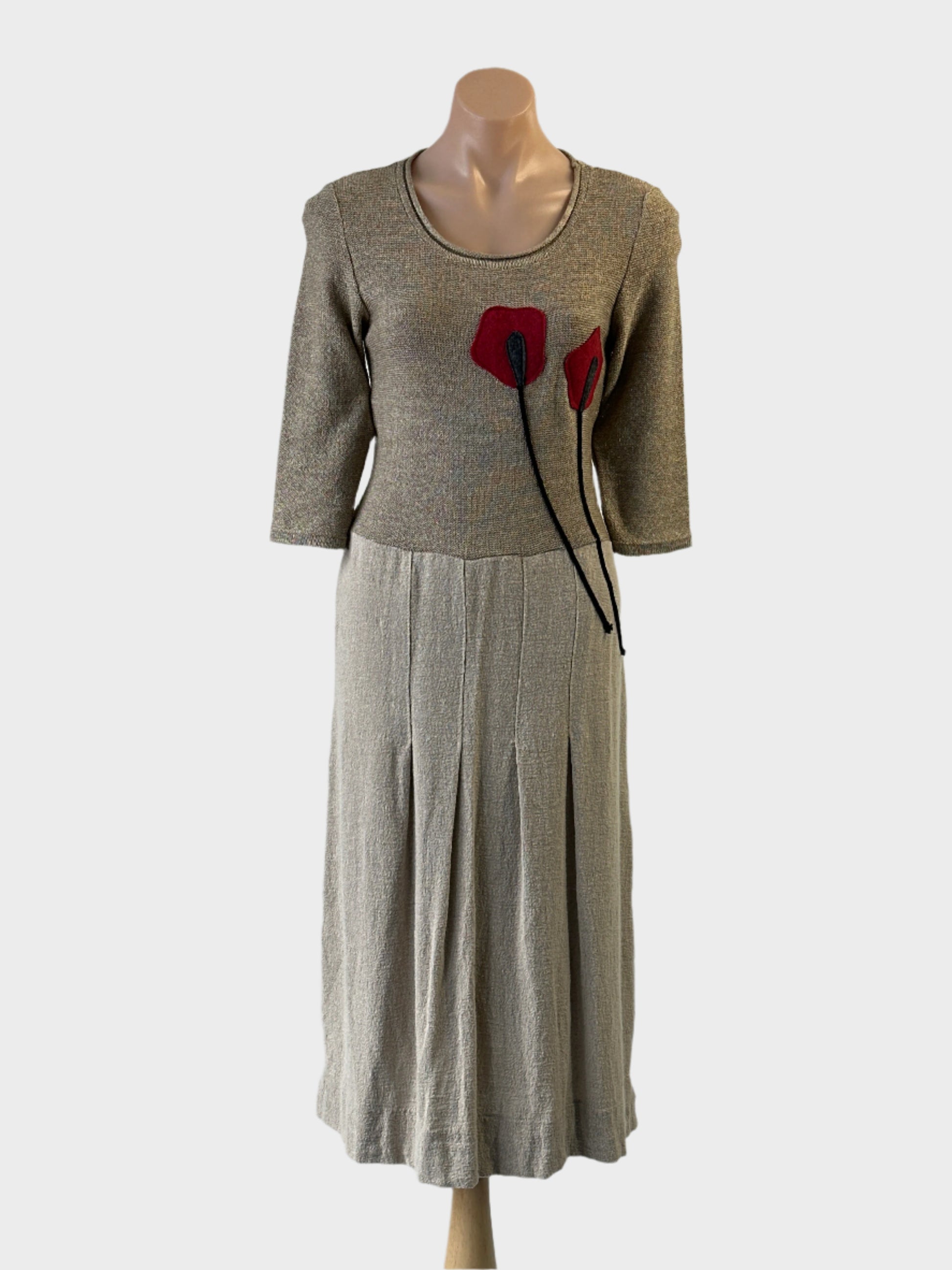 Designer Anetpol drop waist dress in beige with floral appliqué and pleated skirt for special events or office wear.