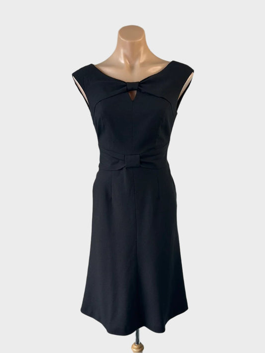 Designer Ann Klein sleeveless A-line dress in black with keyhole neck, loop knot waistband and flared skirt for office or evening wear.