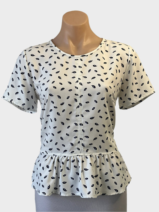 Designer Ann Taylor peplum top in grey and white georgette with wing motif, centre front seam, round neck, short sleeves and keyhole back for office.