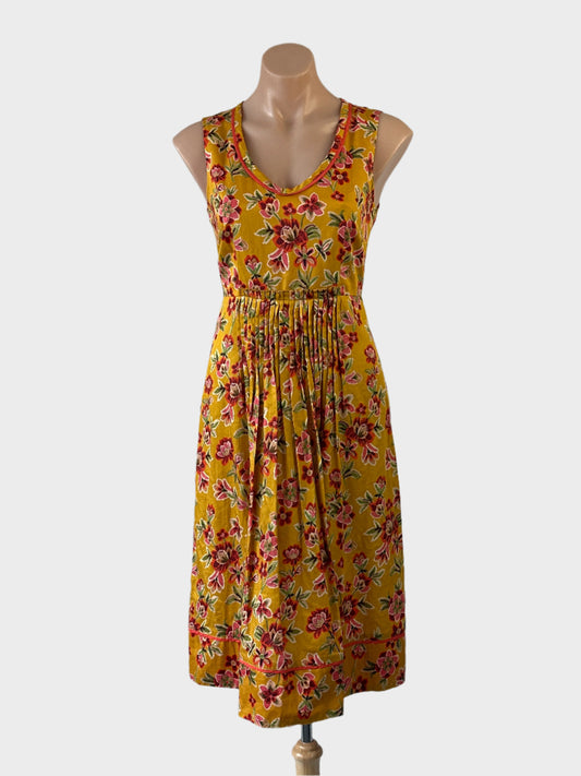 Designer Anna Thomas A-line dress in yellow bright floral print with u-shaped neck, pin tuck waist and pleated skirt for smart casual or office wear.