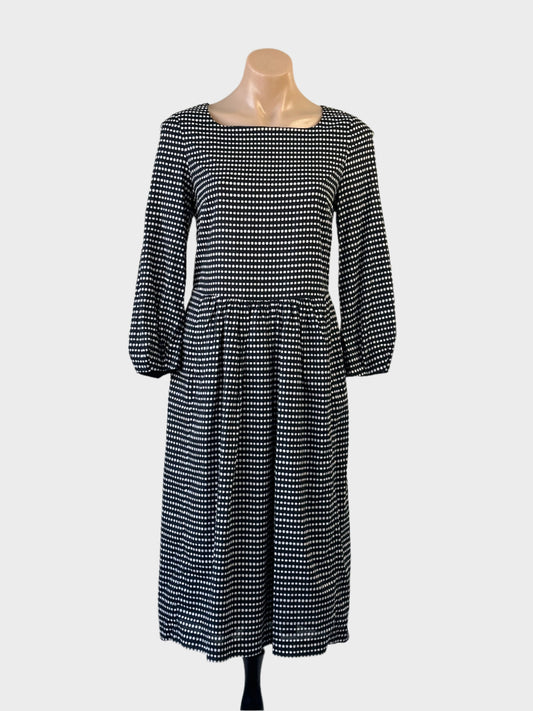 Anna Thomas black and white dot print cotton midi dress with square neck, long puff sleeves and gathered skirt for office or smart casual.