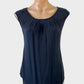 Designer Anna Thomas sleeveless top in grey with sunburst neck, keyhole back and curved hem for office wear.