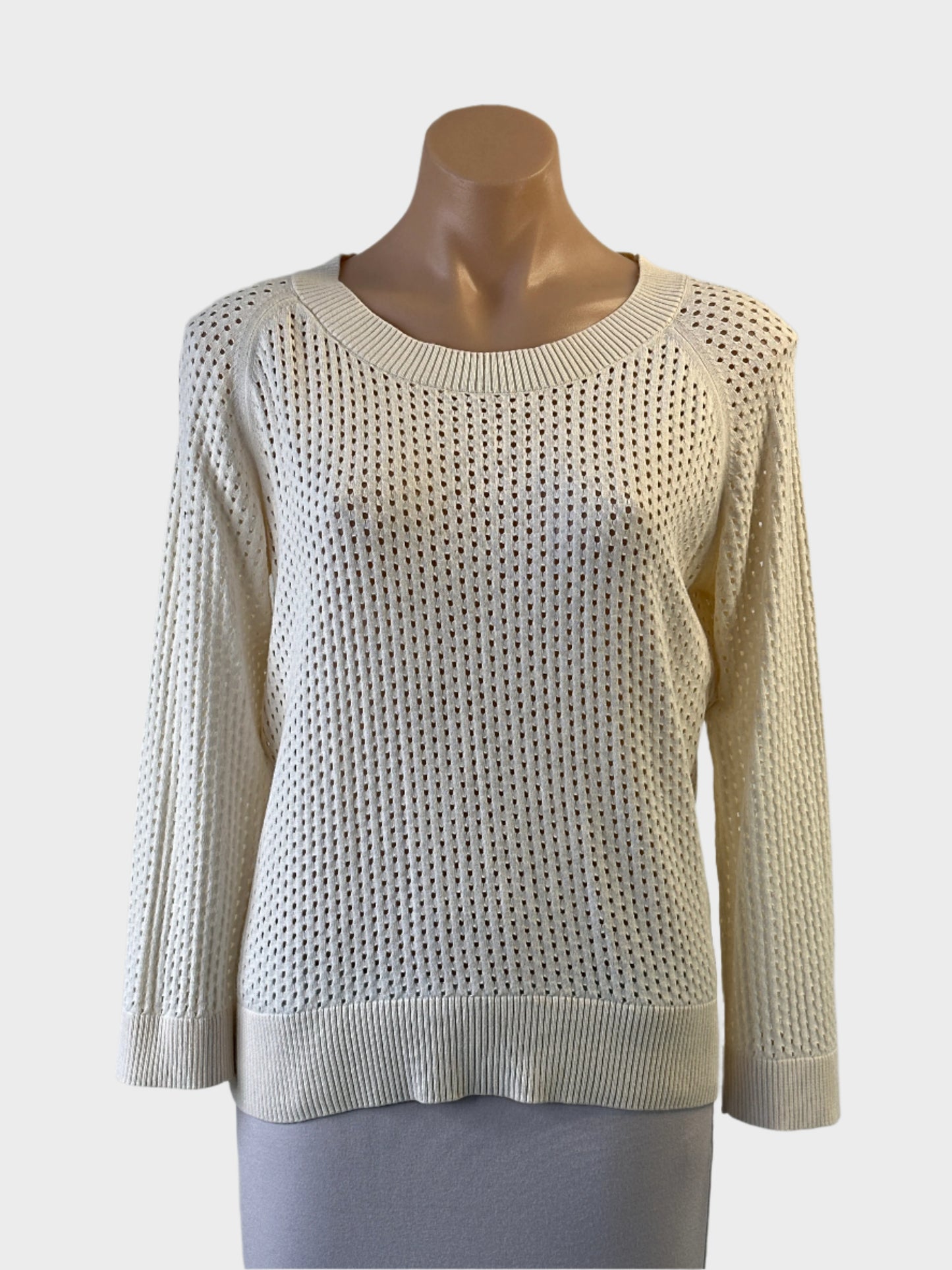 Designer Anna Thomas sweater in white eyelet knit with rib trim and bateau neck for smart casual or resort wear.