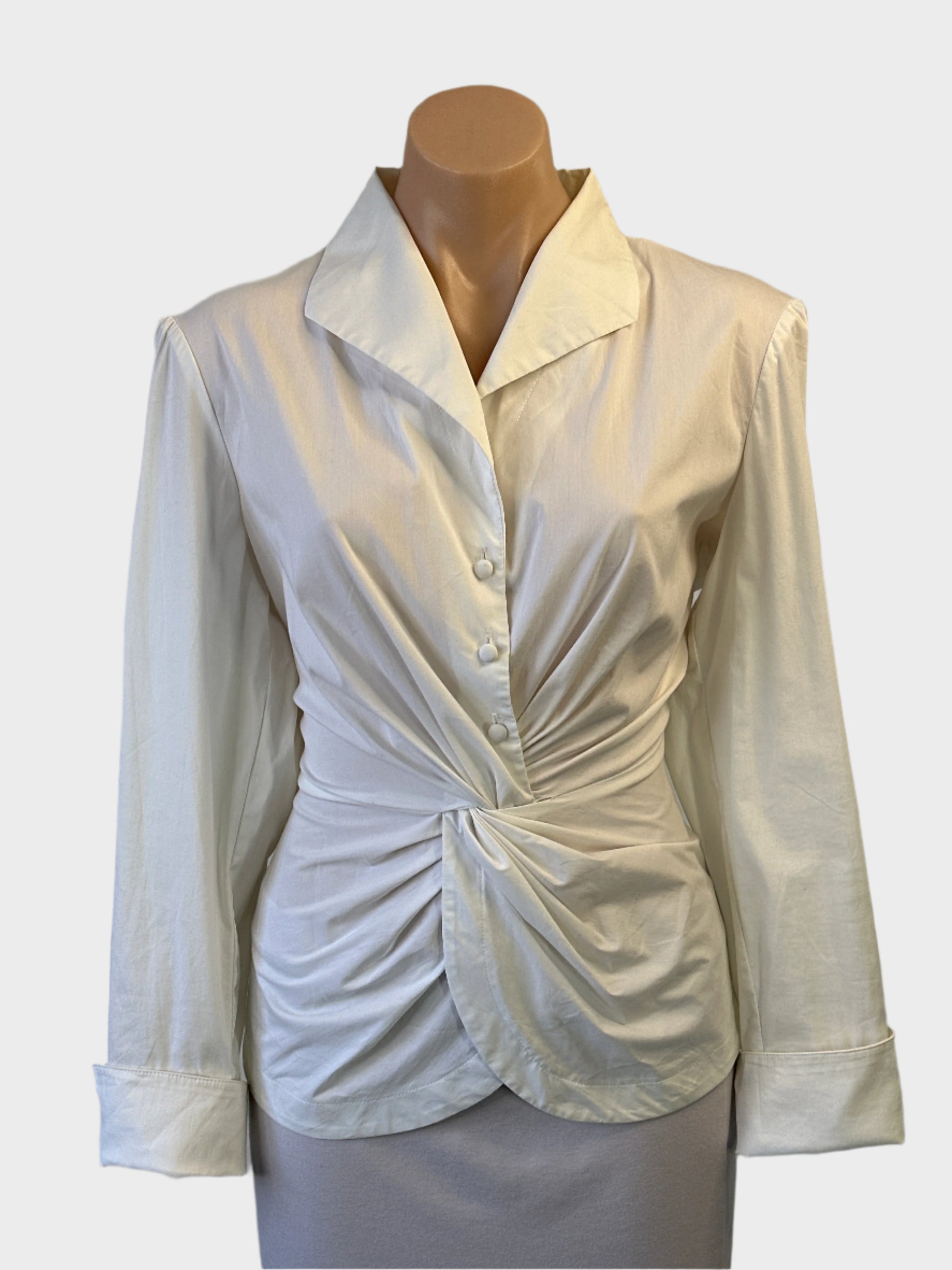 Anthea Crawford sleeveless shirt in white with twist front and wing collar for office wear.