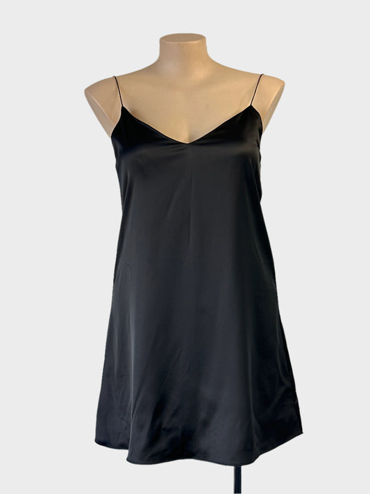 Atmos & Here slip dress in black with v-neck and flared skirt for evening or formal wear.
