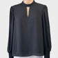 Atmos & Here blouse with keyhole front, narrow band collar tie, and frilled shirred cuffs for evening or office wear.