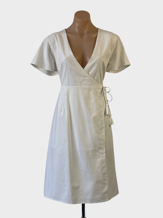 Atmos & Here wrap dress in white linen cotton blend with cap sleeves, cord tie and flared skirt for office or smart casual wear.