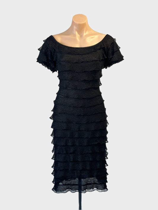 Bang tube dress in black with ruffle trim and layered tiers for evening or formal wear.