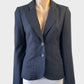 Basque single breasted jacket in navy blue and grey pin dot weave with back pleats for office wear.