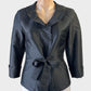 Blooms black taffeta tie front jacket with pleated lapels, three quarter sleeves and curved hem for evening or formal wear