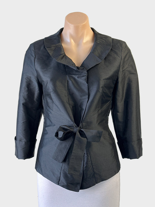 Blooms black taffeta tie front jacket with pleated lapels, three quarter sleeves and curved hem for evening or formal wear