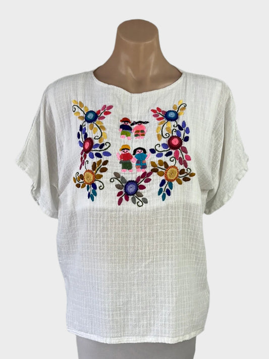 Boho style top in white sheer check weave with multicoloured embroidery and folk art motifs for smart casual wear