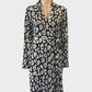 Designer Calvin Klein black jersey wrap dress with abstract leopard print, johnny collar, long sleeves and waist tie for office wear