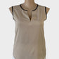 Designer Calvin Klein sleeveless top in beige with contrasting black trim, notched neck and curved hem for office wear.