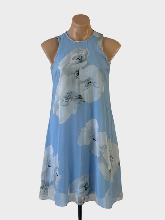 Designer Calvin Klein trapeze dress in blue sheer fabric with floral print, round neck and keyhole back for office or smart casual wear.