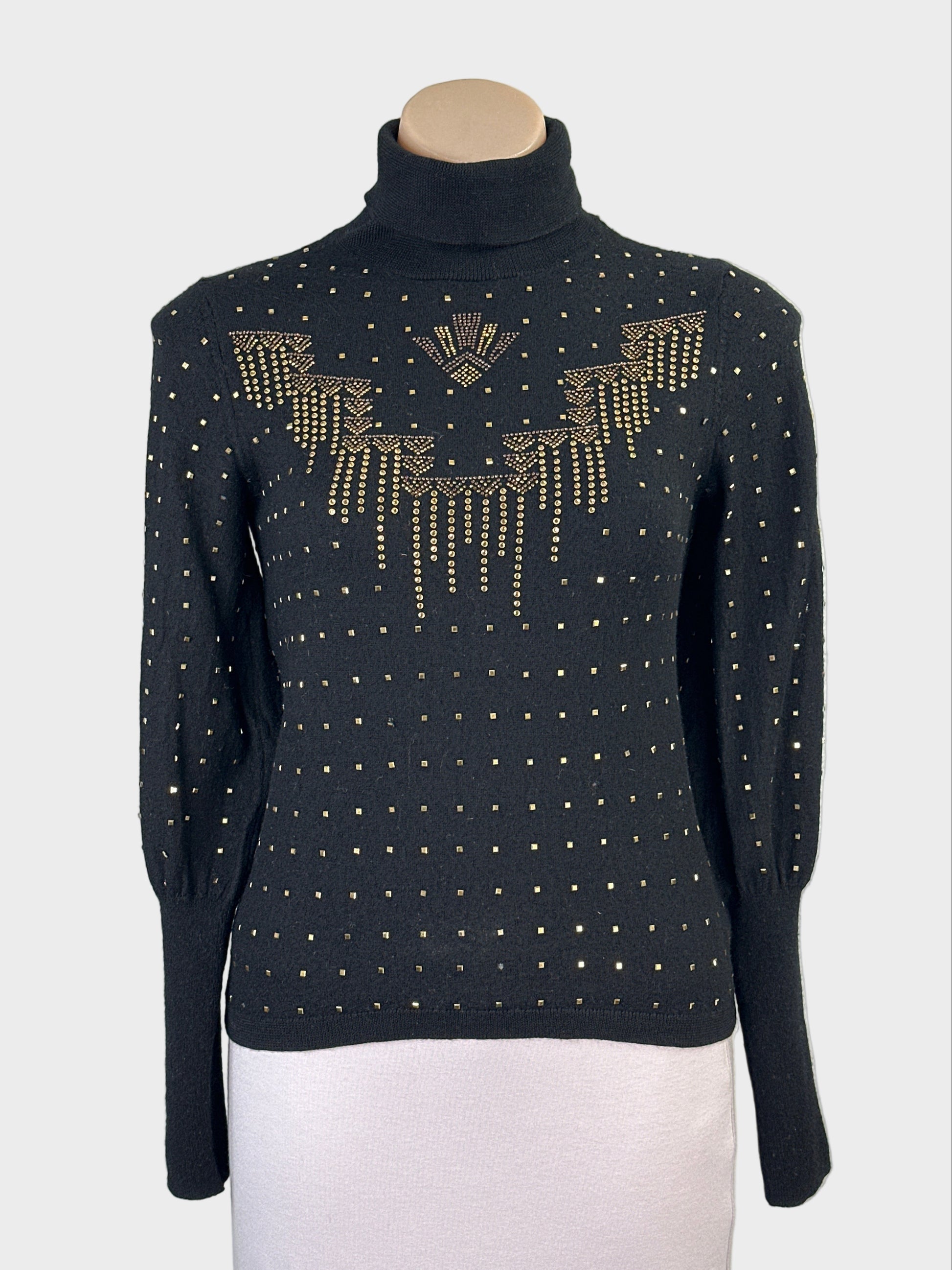 Designer Camilla black wool sweater with applique studded front panel, ribbed turtleneck and barrel cuffs for evening or office wear.