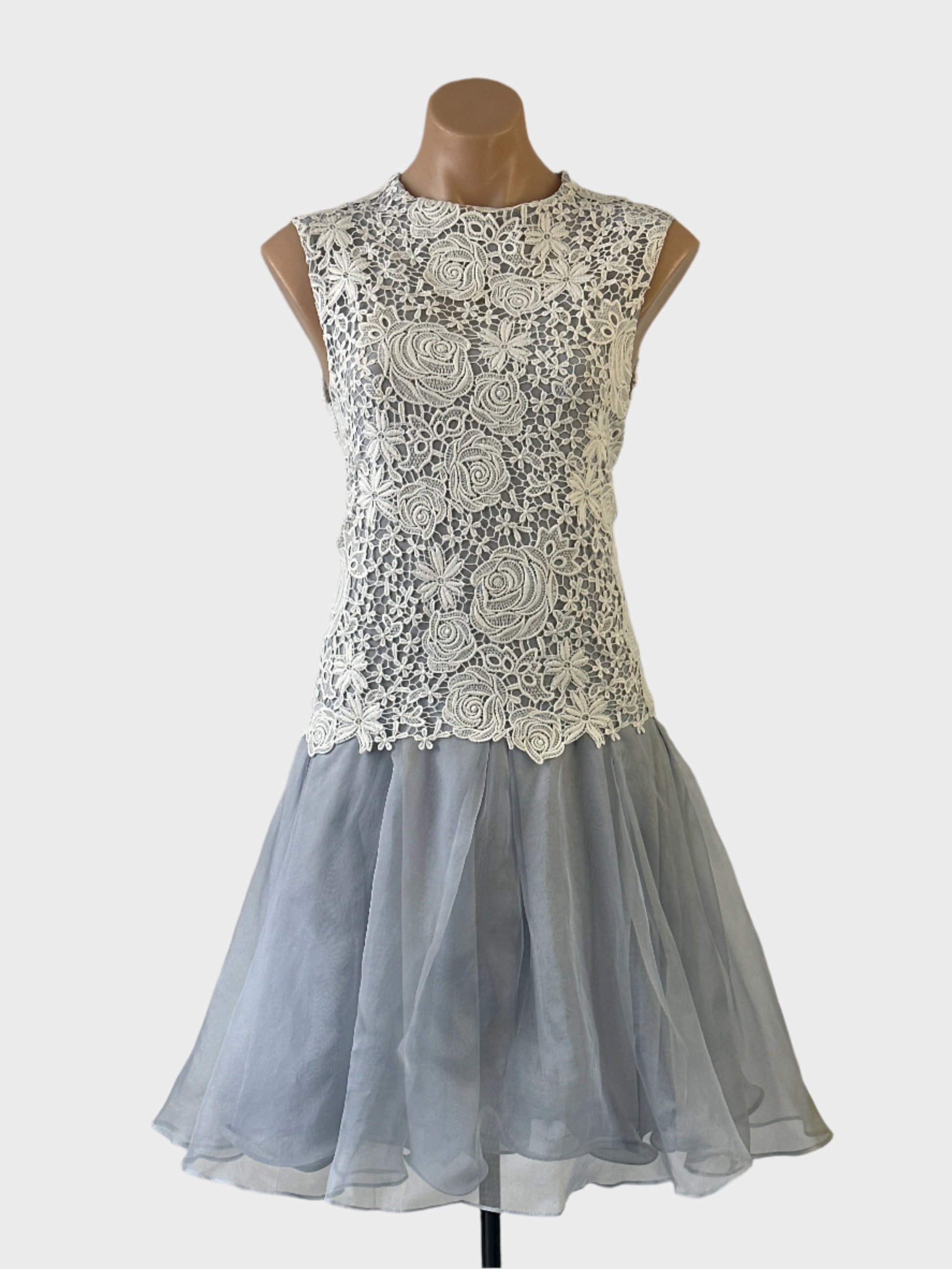 Designer Carla Zampatti drop waist dress in blue sheer silk organza with lace overlay, round neck and pleated skirt for formal or special events.