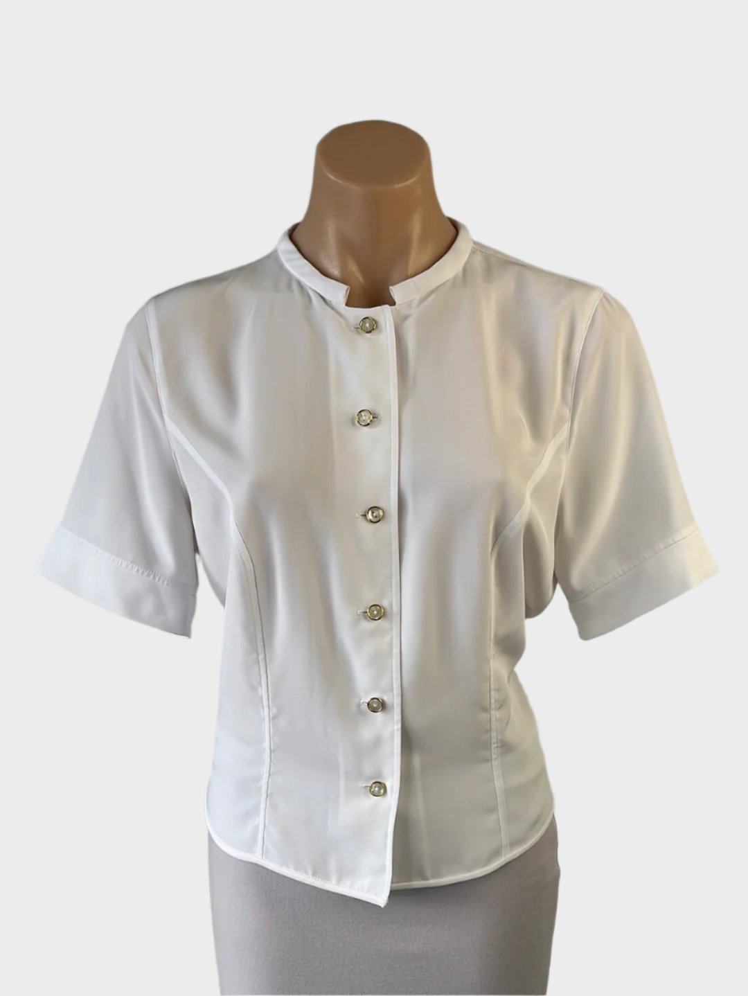 Designer Anna Braun white shirt with mother of pearl buttons, band collar, and short sleeves with banded cuffs for office or smart casual wear.