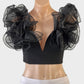 Club London crop top in black with notched neck and sheer organza ruffle for evening or formal wear.