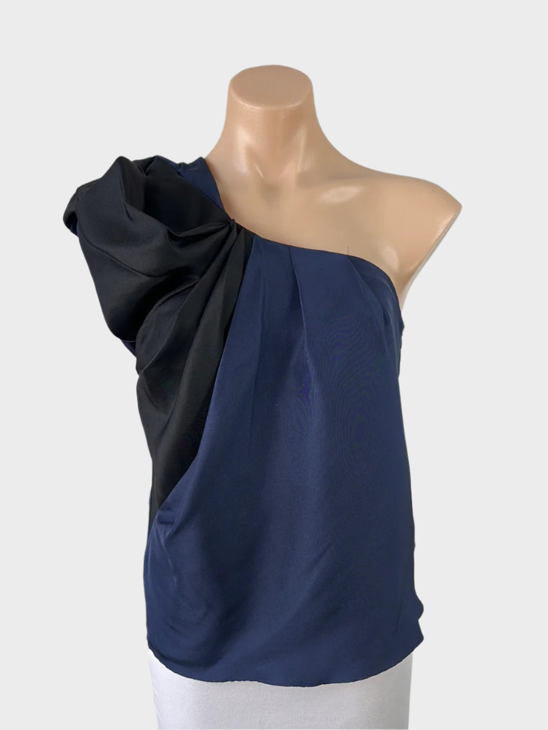 Designer Country Road blue and black one shoulder top in silk satin, with draped front, and pleated shoulder strap for formal wear.