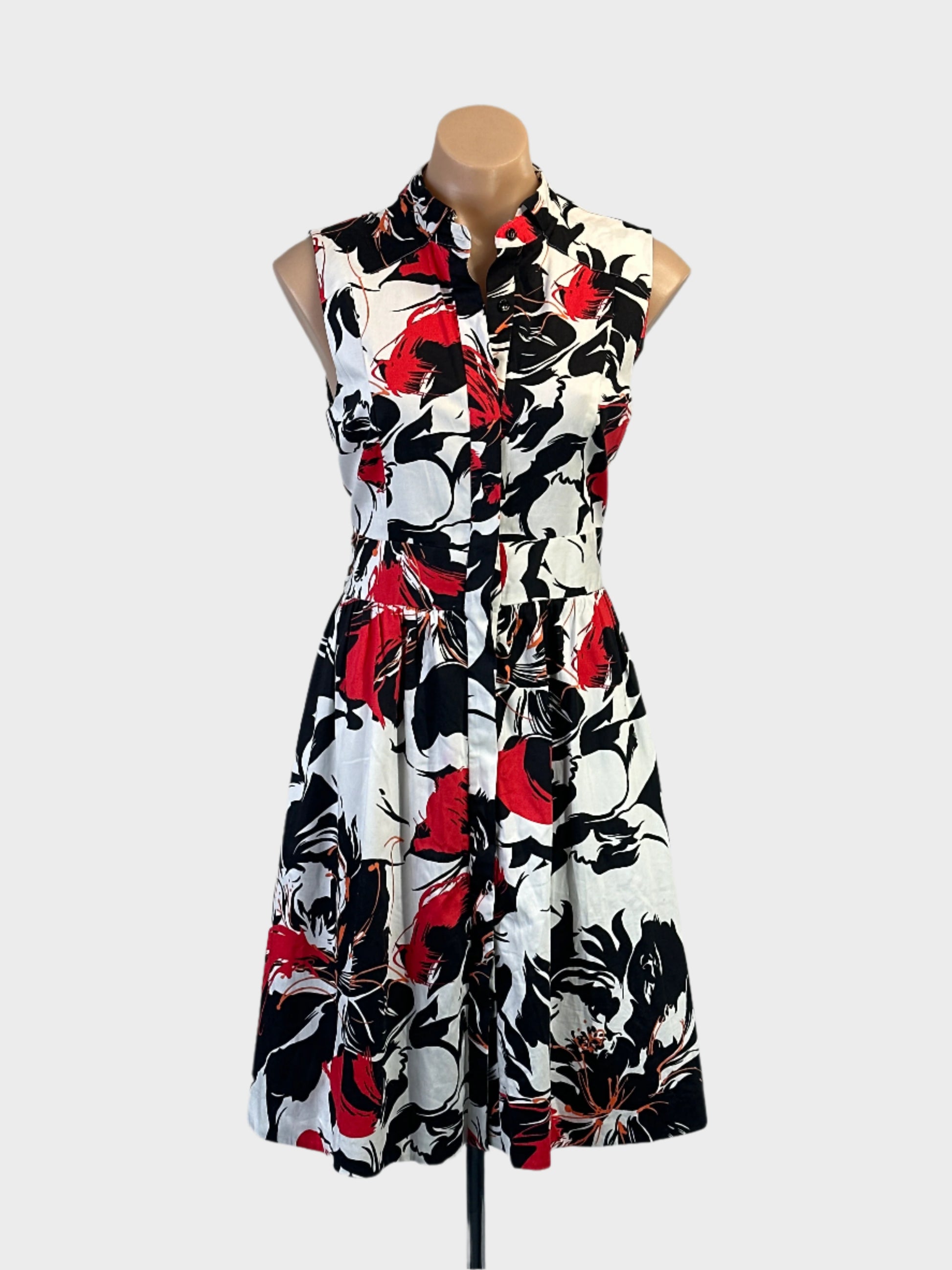 Cue sleeveless A-line shirt dress in multicoloured floral print with wide waistband for office or smart casual wear.