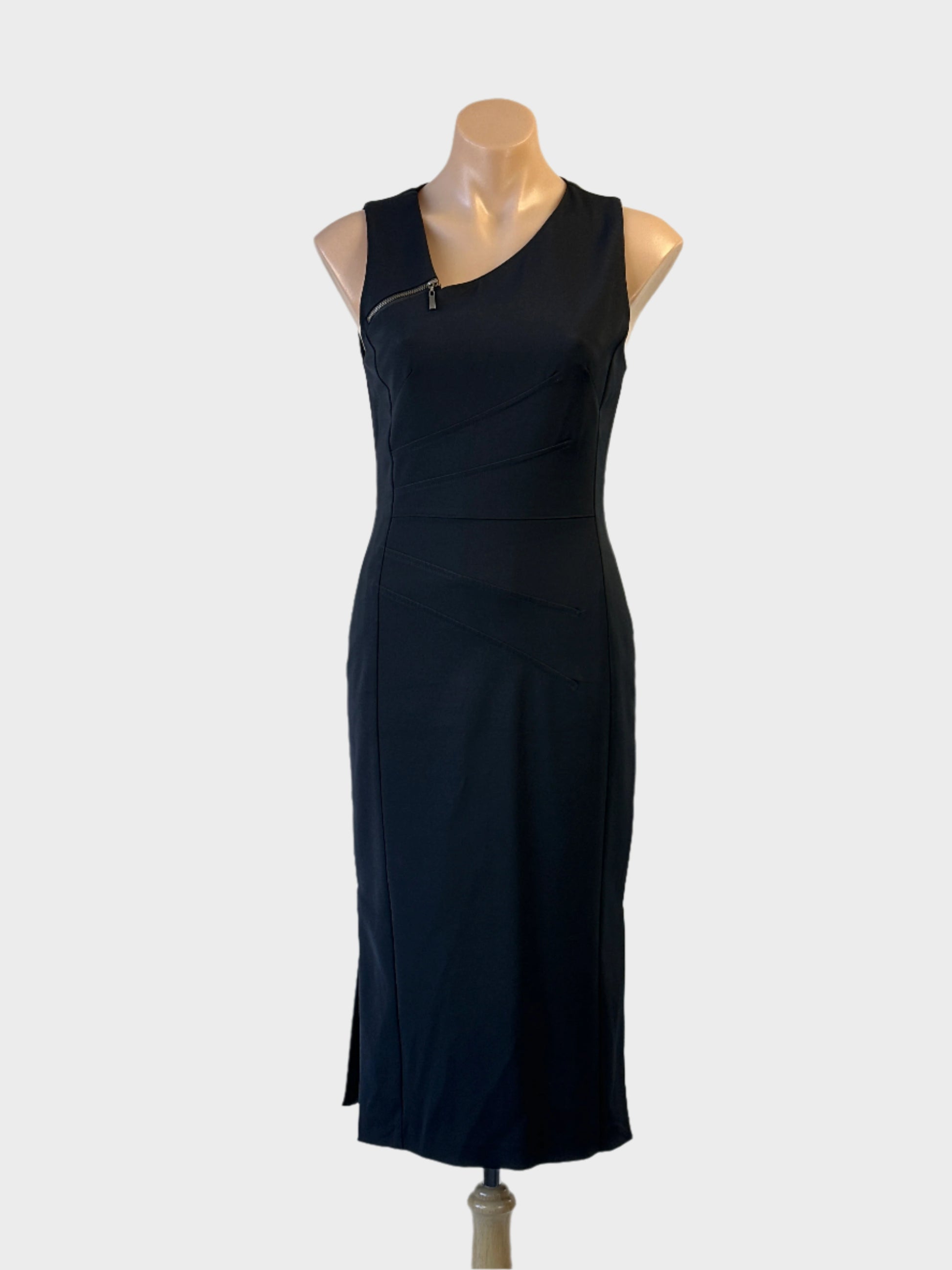 Cue midi length sleeveless black dress with asymmetrical zip neck, panel shaping and back vent for office or formal wear.