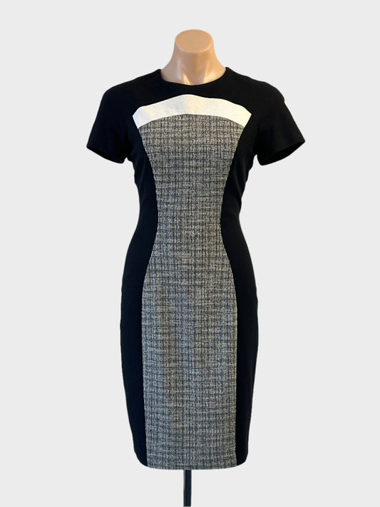 Cue shift dress in black and white with textured front panels and back vent for office or evening wear.