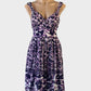 David Lawrence sleeveless A-line dress in purple cotton silk blend with ikat floral print, surplice neck and pleated skirt for smart casual or resort wear.