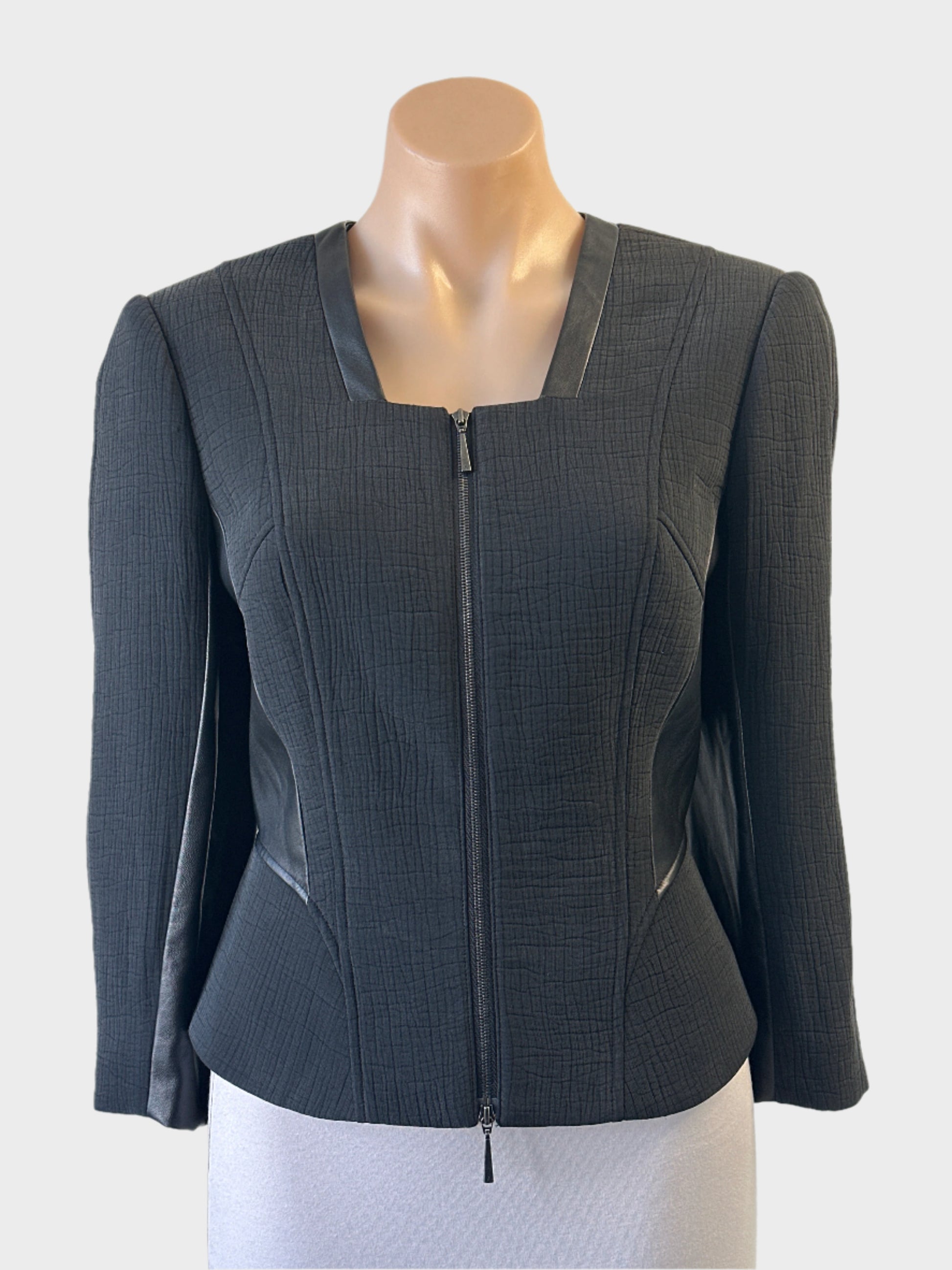 David Lawrence Atelier black zip front jacket in textured weave with faux leather trim for office or evening wear.