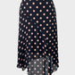 David Lawrence black and pink flared panel skirt in sheer fabric with polka dot print and handkerchief hem for office wear.