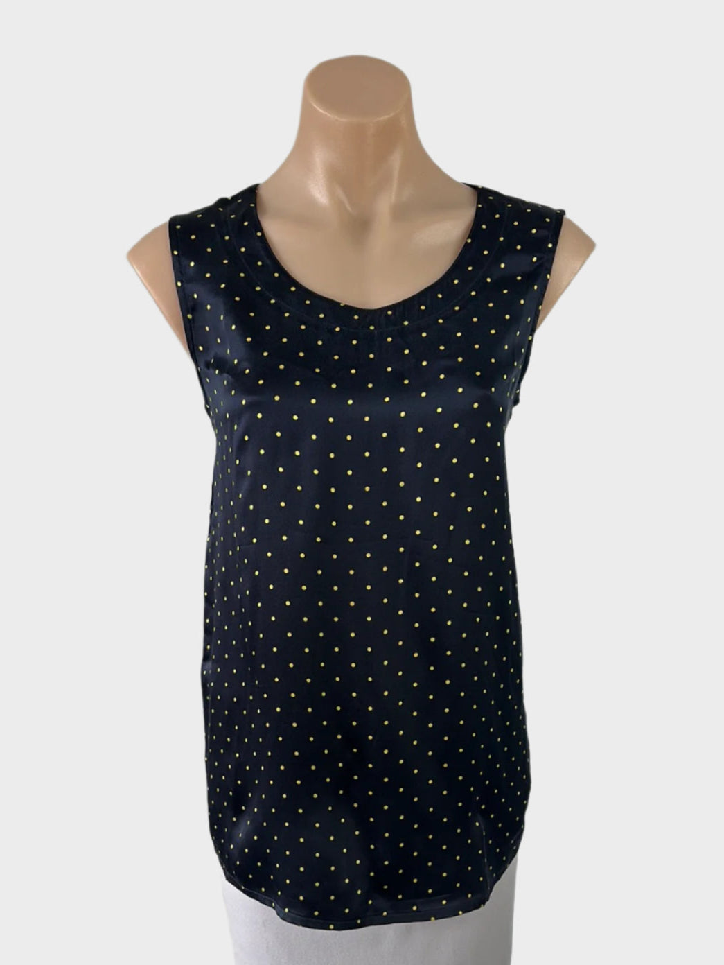 Designer ARA black and gold sleeveless top with polka dots, satin finish, and scoop neck for evening or office wear.