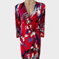 Designer BCBG Max Azria red drop waist dress in jersey with bright brushstroke pattern and pleated skirt for office wear