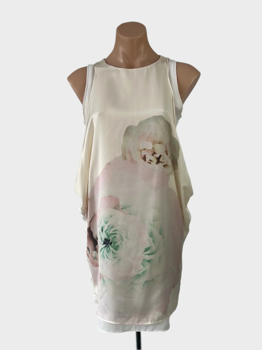 Designer bYSI cream cocoon dress in crepe with satin overlay, watercolour floral print, and exposed back zip for special occasion wear.