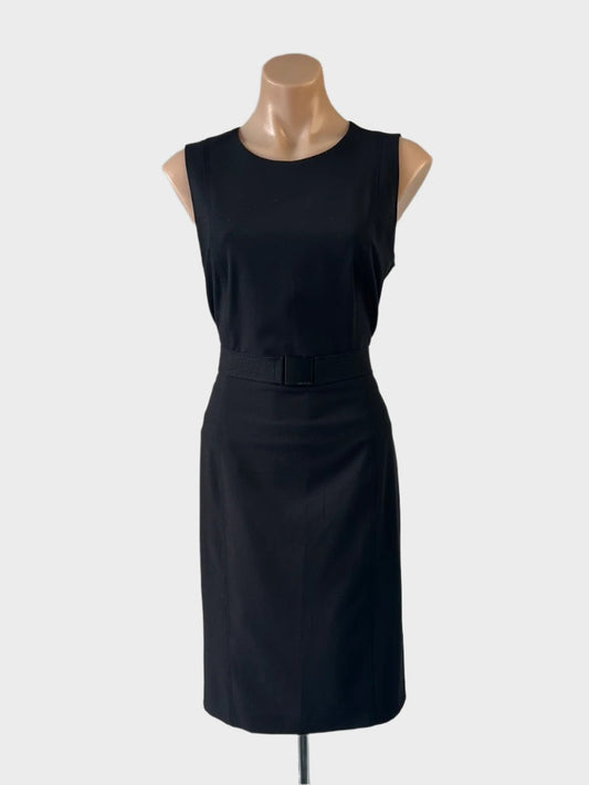 Designer Calvin Klein sleeveless shift dress in black with decorative top-stitched seams, belt with metallic buckle, and straight skirt for office wear.