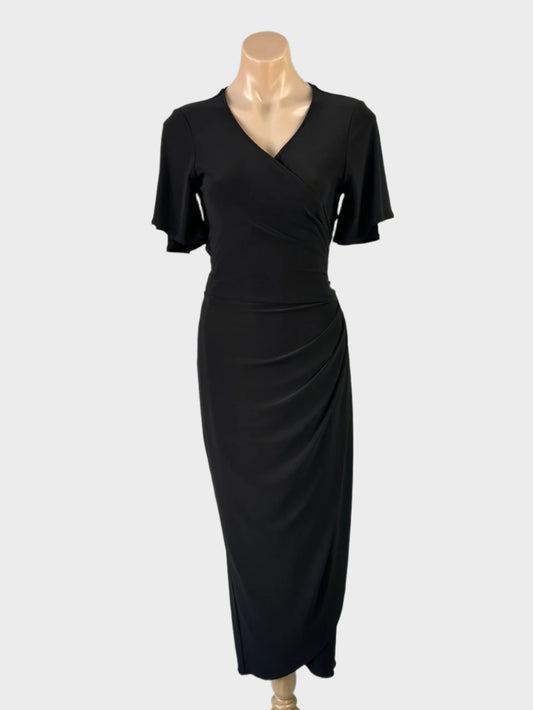 Designer Leina Broughton black wrap dress in jersey with surplice neck, flutter sleeves, and tulip skirt for office or evening wear.