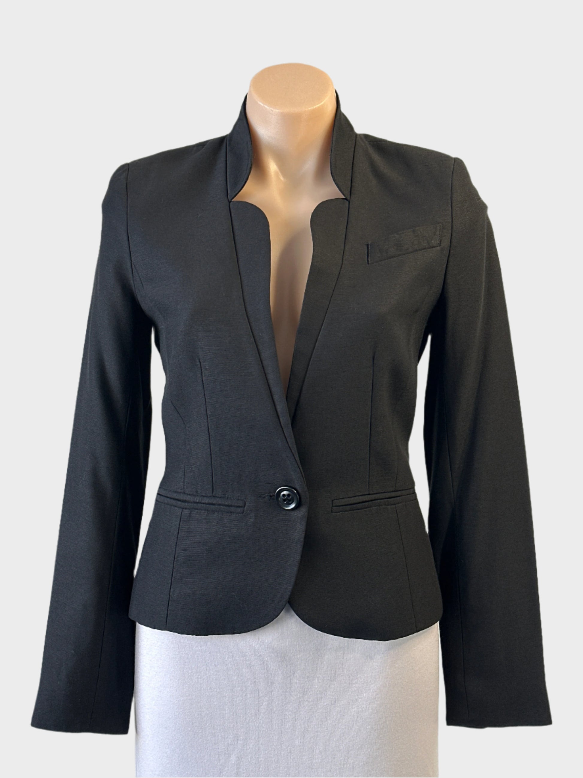 Designer Lover black single breasted jacket with one button closure and welt pocket for evening or office wear.